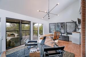 an office with a desk and chairs in a room with windows at Prescott Mountain Luxury Escape! in Prescott +34 photos