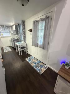a small kitchen with a table and a window at Cozy Creek Retreat in Waterford
