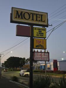 a motel sign on the side of a road at Top1Capricorn in The Range