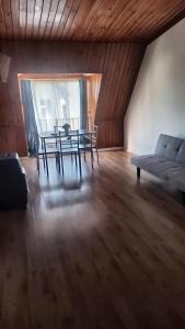 a living room with a table and a couch at Dpto central y remodelado in Valdivia +3 photos