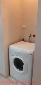 a white washer and dryer in a room at Classy 1Bedroom with Balcony in Punta Engaño