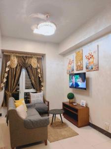 a living room with a couch and a table at Classy 1Bedroom with Balcony in Punta Engaño
