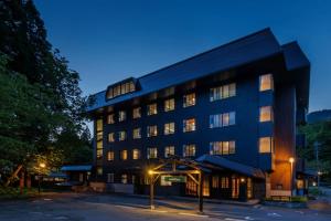 a large black building with lights in front of it at Takamiya Hotel Hammond in Zaō Onsen +62 photos