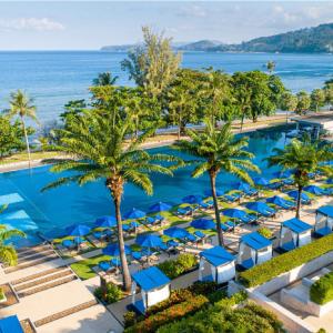 an aerial view of a resort with a pool and palm trees at Hyatt Regency Phuket Resort in Kamala Beach