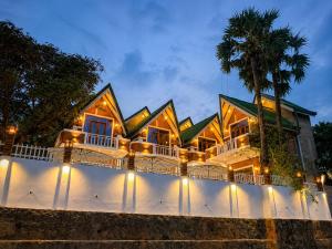a house with lights on the side of it at The Oshin Villa in Trincomalee