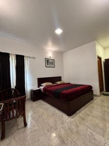 a bedroom with a large bed in a room at Green woods stays in Ooty