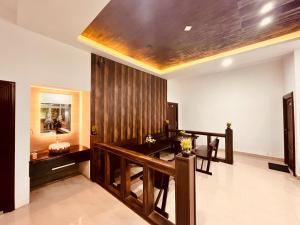 a living room with a desk and a mirror at The Raarees Mist Resort, Munnar - Nested in Nature's Lap in Munnar
