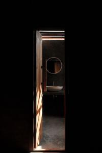 a bathroom with a sink and a mirror at Cay's House Batukaras in Batukaras +18 photos