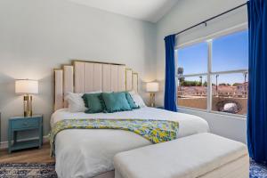 a bedroom with a large bed and a window at Resort-Style 5BR Heated Pool Putting Green in Glendale +76 photos