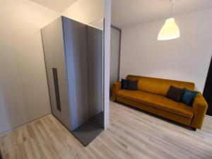 a living room with a couch and a sliding door at Bran' s in Constanţa