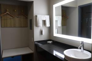 a bathroom with a sink and a mirror at Days Inn by Wyndham Payson in Payson +75 photos