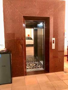 a hallway with a mirror in a room at Thanh Dat 2 Hotel in Vinh