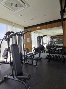 a gym with lots of treadmills and machines at Escapada romántica- decoración sobre pedido in Nuevo Vallarta