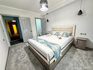 a bedroom with a large bed in a room at Joy Fergana Guesthouse in Fergana