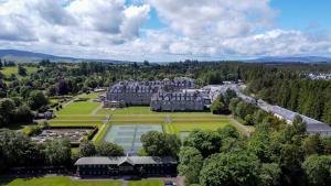 an aerial view of a large building with a park at Gleneagles Village Penthouse in Tullibardine Station
