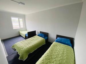 a room with two beds in a room at Family nest in Kochkorka