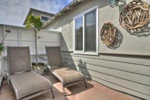 two chairs sitting on a patio next to a house at San Clemente - Monterey C in San Clemente +13 photos