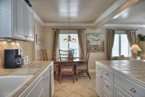 a kitchen with a table and a dining room at San Clemente - Monterey C in San Clemente