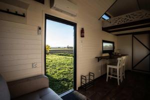 a view from the inside of a tiny house with a window at Dolce Casa 2 by Tiny Away in Rigutino