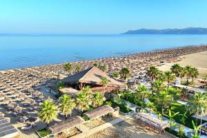an aerial view of a beach with umbrellas and palm trees at Perla Penthouse - Happy Rentals in Mullini i Danit