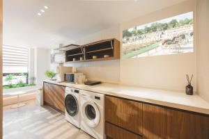 a laundry room with a washer and dryer in it at Mumum Jongno in Seoul