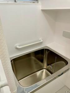 a stainless steel sink in a small kitchen at サニーサイドホステル2号館 in Uji +80 photos