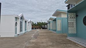 a row of houses with blue and white at เอ็นแอนด์พี รีสอร์ทบุรีรัมย์ in Ban Don Wai +18 photos