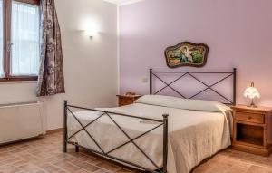 a bedroom with a bed in a room at Awesome Apartment In Roccastrada in Roccastrada
