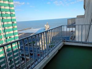 a balcony of a building with a view of the ocean at Hotel Rivoli in Mar del Plata