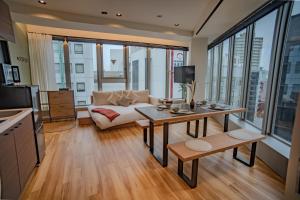 a living room with a couch and a table at ORI Ikebukuro in Tokyo