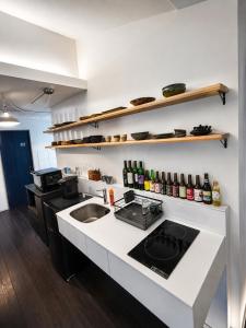 a kitchen with a sink and a counter top at 出雲大社まで徒歩5分 一棟貸し宿 はれいろ in Izumo