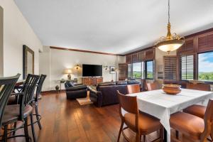 a dining room and living room with a table and chairs at Radisson Hotel La Crosse in La Crosse