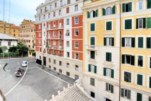 a view of a city street with buildings at Piranesi Charmsuite in Rome