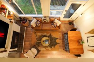 an overhead view of a living room with a fireplace at Riversong Retreat in Glacier +39 photos