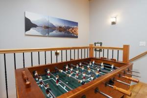 a room with a foos ball in a table at Snowline Hillside Chalet in Glacier