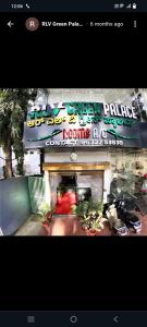 a picture of a building with a sign on it at RLV green palace in Bangalore