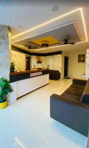a lobby of a hotel with a reception desk at Hotel New Vinay in Kapadvanj