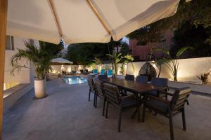 a patio with a table and chairs and a pool at Luxury stay at a great price 88 by Spacey #71 in Cairo