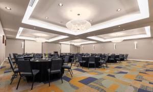 a large room with tables and chairs in a room at Hampton Inn & Suites by Hilton Miami Downtown/Brickell in Miami