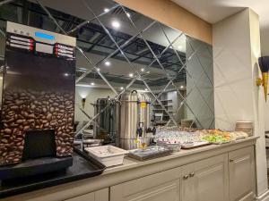 a kitchen with a counter with food on it at Reo Hotel in Antalya