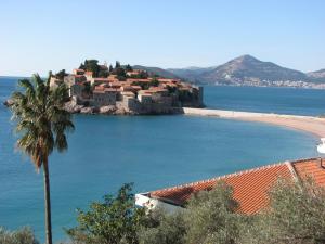 a small island in the middle of a beach at Apartments Secret Garden in Sveti Stefan