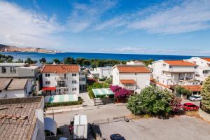 an aerial view of a city with buildings and the ocean at Apartments Stevo Nikočević in Bar