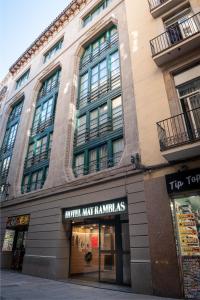 a store front of a building on a street at May Ramblas Hotel in Barcelona