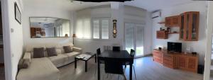 a living room with a couch and a table at CASA MARUJA in Ávila