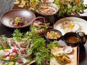 a table topped with plates of food and bowls of food at お宿行灯鳥羽 in Toba +63 photos