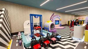 a room with a play room with toys on the floor at Pallavi West in Panchkula