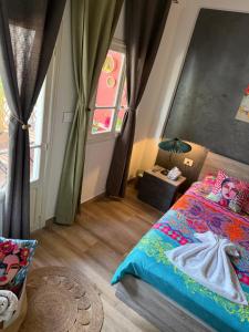 a bedroom with a bed and a window at Byout Beirut’s M1 in Beirut +24 photos