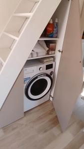 a kitchen with a washer and dryer in a room at 2 4 D2 Mini Condos Studio Loft West facing in Tivat