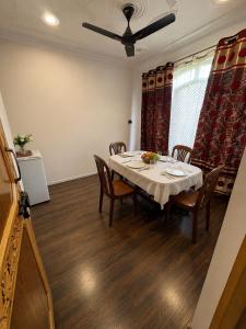 a dining room with a table and chairs at Sultan Homestay in Srinagar