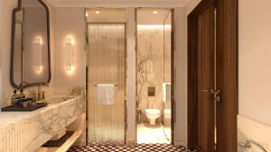 a bathroom with a toilet and a sink at Petra Hotel Belgrade in Belgrade